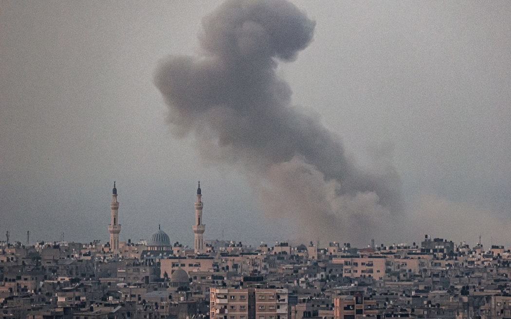 A smoke plume billows after Israeli bombardment in Rafah in the southern of Gaza Strip on October 28, 2023 amid the ongoing battles between Israel and the Palestinian group Hamas. (Photo by SAID KHATIB / AFP)