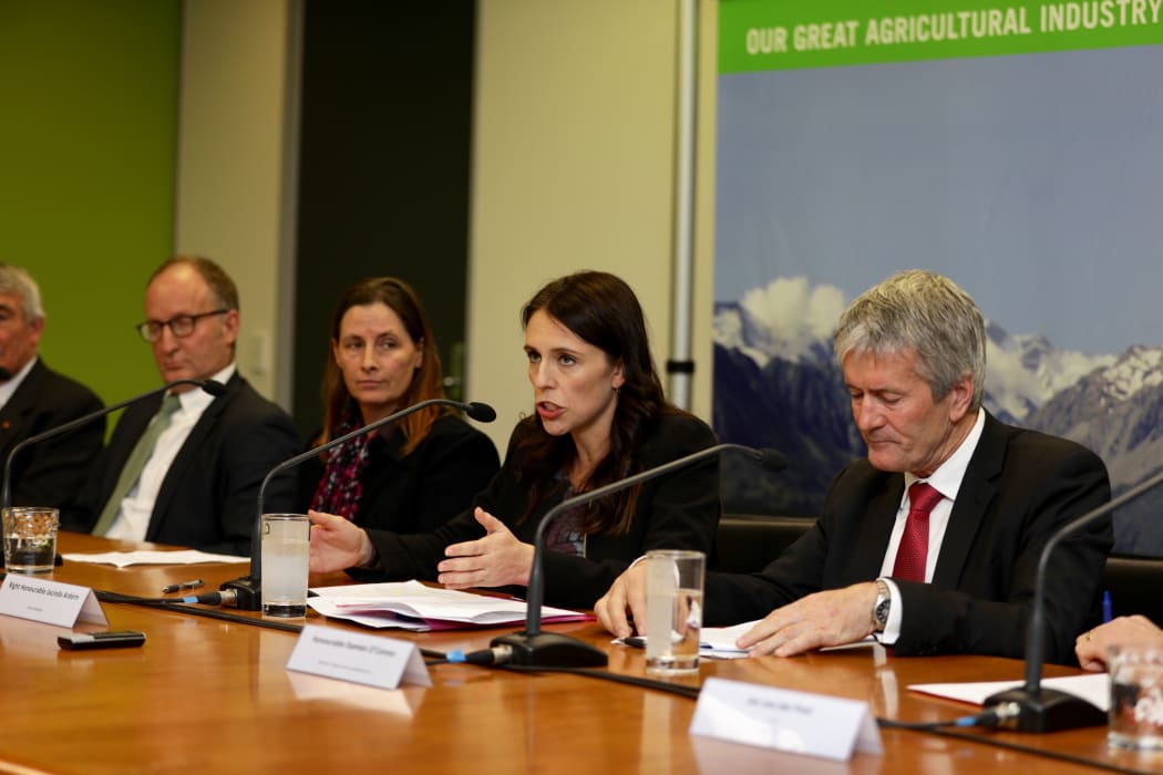 Prime Minister Jacinda Ardern, centre, announces the government's decision to attempt to eradicate the cattle disease