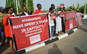 Protesters hold placards during a demonstration marking the third anniversary of the abduction of the Chibok girls in Abuja in April.