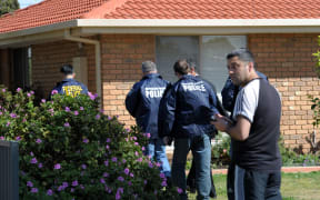 Federal police at a house in the Melbourne suburb of Seabrook.