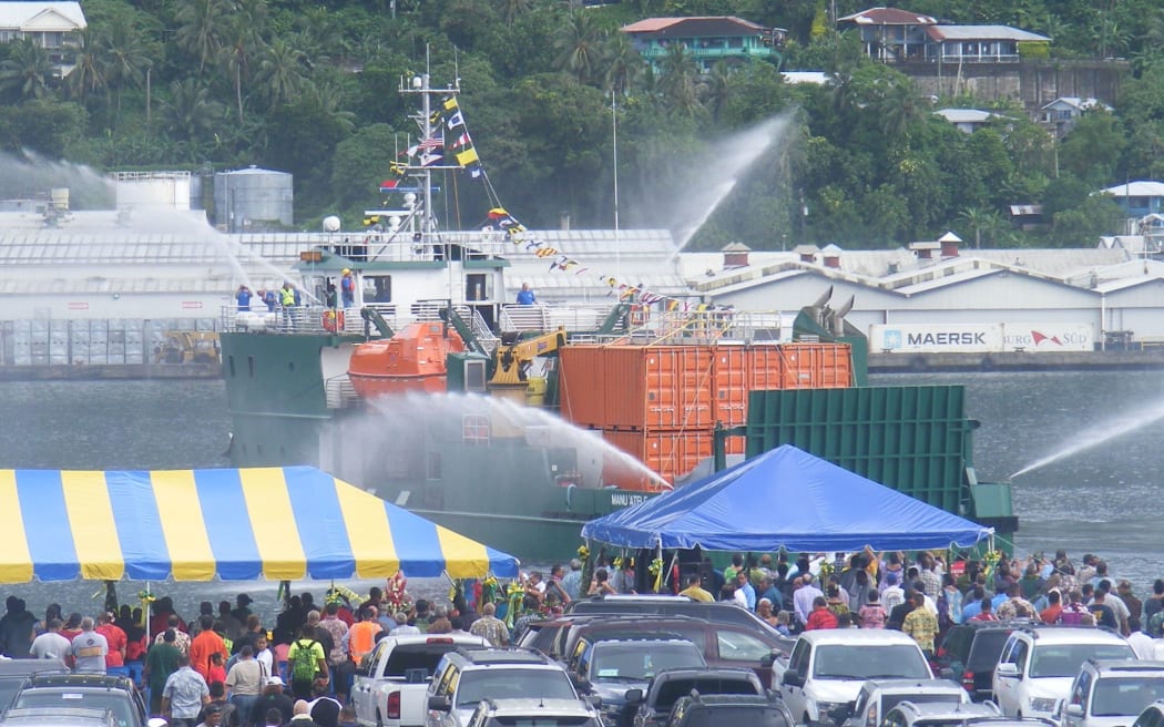 American Samoa’s $13.6 million new vessel arrives at the Port of Pago Pago’s main dock area which was  packed with a large crowd, as horns blared throughout the main town area to welcome the vessel, as it sprays water into the ocean.