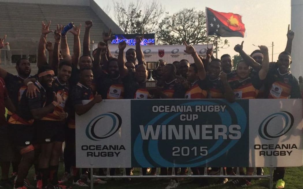Papua New Guinea players celebrate winning the Oceania Cup rugby tournament.