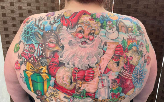 Jessica Moore spent thousands of dollars on a full back tattoo with all the North Pole has to offer.