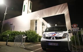 A police van stationed at at the mosque in the Paris suburb of Creteil where a man tried to drive a car into a crowd.