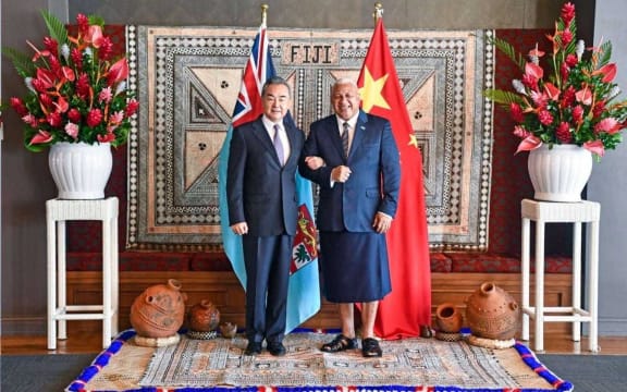 Chinese Foreign Minister Wang Yi and Fiji Prime Minister Frank Bainimarama.