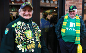 Norwich City fans celebrate their return to the Premier League.