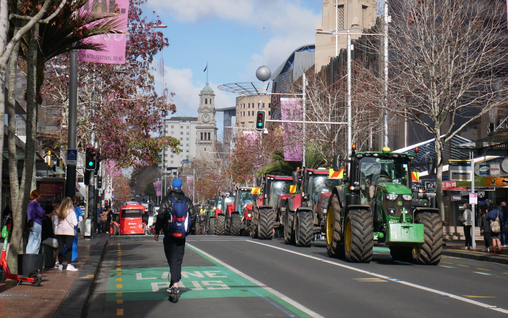 Protesters in utes and tractors driving down Queen St, Auckland.