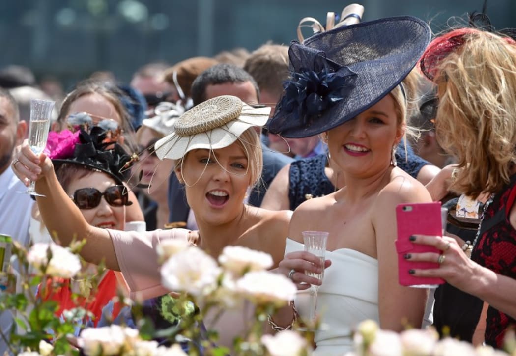 Racegoers at 156th Melbourne Cup last year.