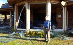 Don McIntosh in front of his condemned house in Mt Lyford.