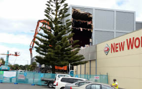 The demolition of the Queensgate Mall begins.