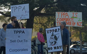 Protesters outside the hui.