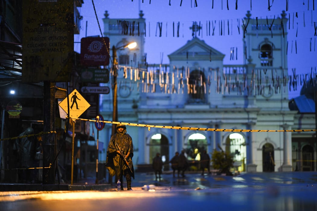 Sri Lankan soldiers stand guard under the rain at St. Anthony's Shrine in Colombo on April 25, 2019, following a series of bomb blasts targeting churches and luxury hotels on the Easter Sunday in Sri Lanka.