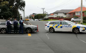 Police surround a house in Bardia Street, Belmont.