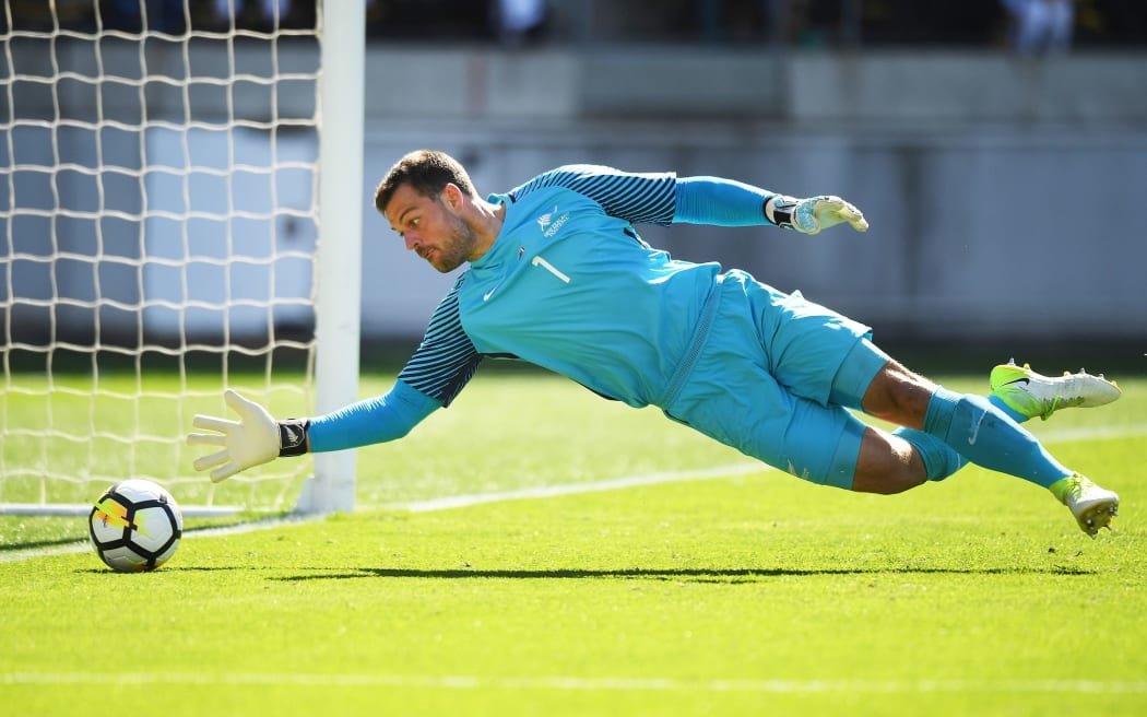 New Zealand goalkeeper Stefan Marinovic makes a save on the line.