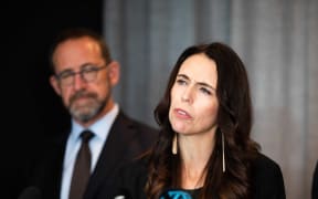 Prime Minister Jacinda Ardern, with Health Minister Andrew Little, left, announces the first batch of Pfizer-BioNTech vaccines is due to arrive next week.