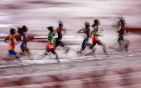 TOKYO, JAPAN - AUGUST 02:  The athletes compete during the Women's 5000 meters Final on day ten of the Tokyo 2020 Olympic Games at Olympic Stadium on August 02, 2021 in Tokyo, Japan. (Photo by Amin JAMALI/ATP Images)