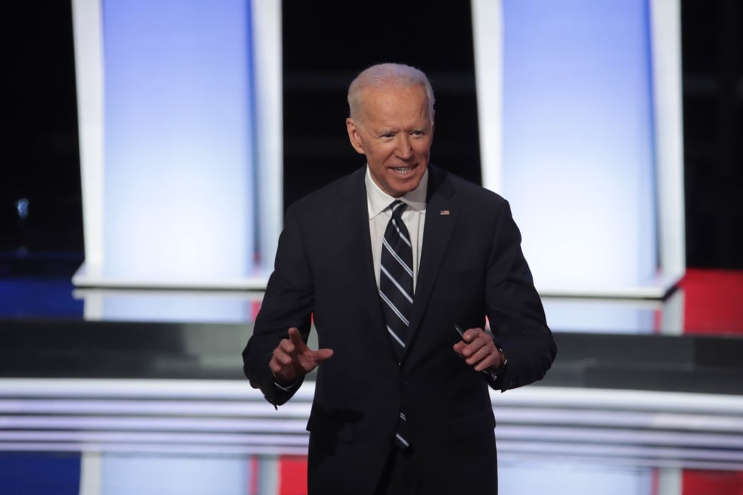 Democratic presidential candidate former Vice President Joe Biden stands on stage after the Democratic Presidential Debate at the Fox Theatre  in Detroit, Michigan.
