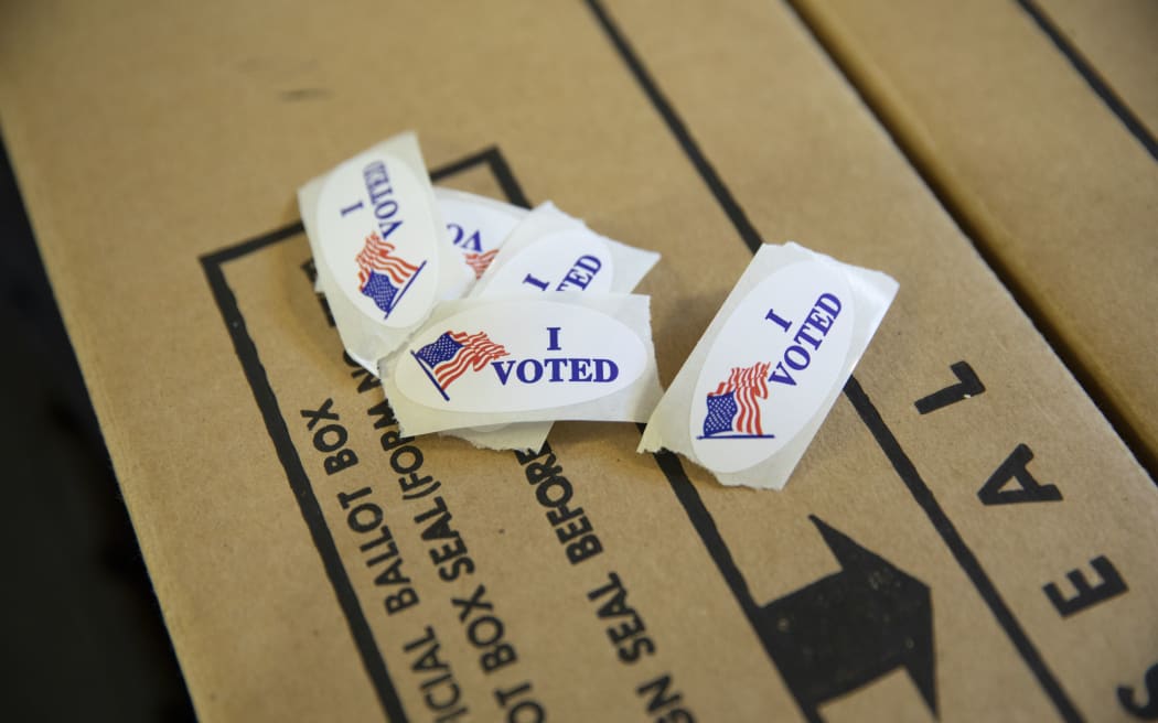 "I Voted" stickers rest on the top of a ballot box inside a polling location in Modesto, California.
