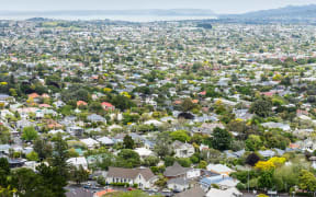View from above of residential streets and houses housing in Auckland.