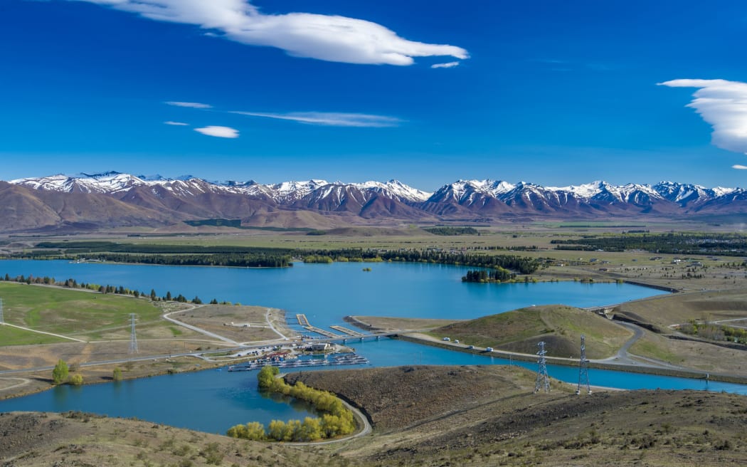 View of Lake Ruataniwha looking towards the Twizel township and Southern Alps.