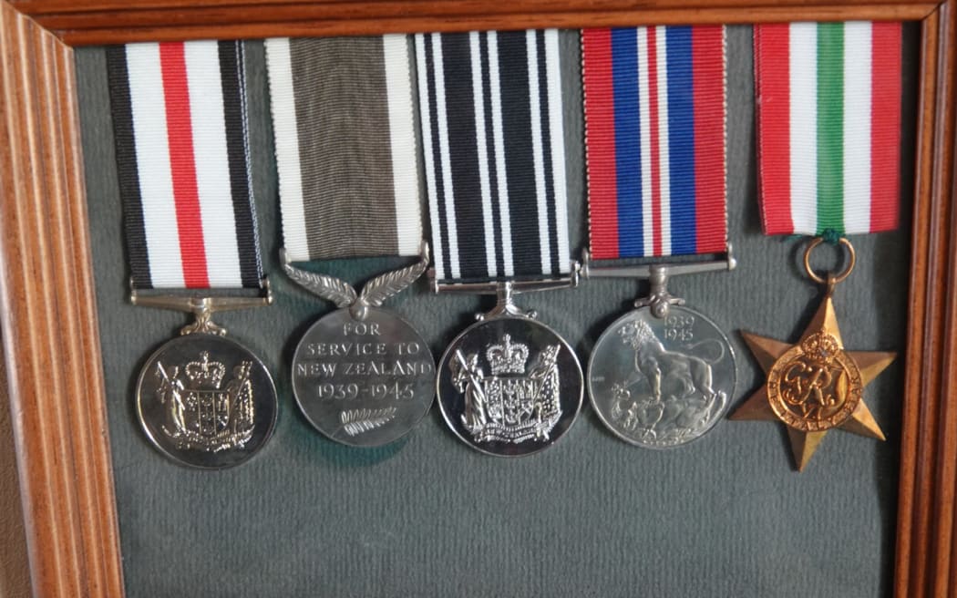 Oliver Candy's war medals hang proudly on the wall of his passageway.