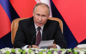 Russian President Vladimir Putin giving a press conference in Tehran
