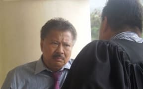 Former Samoa MP Muagututagata Peter Ah Him, convicted of forgery, speaking to his lawyer outside court.