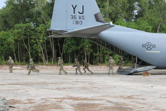 A US Air Force C-130 Hercules delivering US Army Pacific Soldiers onto Palau's Angaur Airfield.