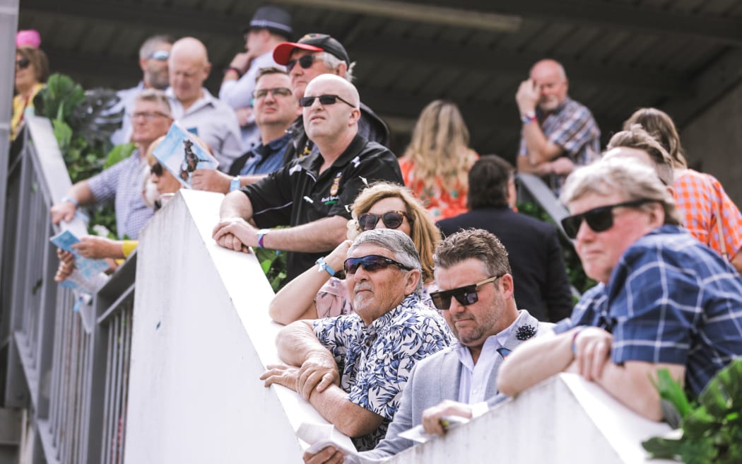 Crowds excited for New Zealand Trotting Cup at Addington Raceway in Christchurch.