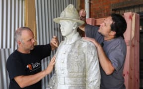 Statue of Warrant Officer Class II. Sergeant Major, Herewini Whakarua.
Marco Buerger and Aaron Te Rangiao from Goldfield Stone, working on the statue.