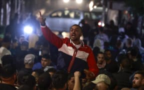 Palestinians in the West Bank city of Ramallah rally in solidarity with the Palestinians of the Gaza Strip after hundreds were killed in a Gaza hospital bombing.