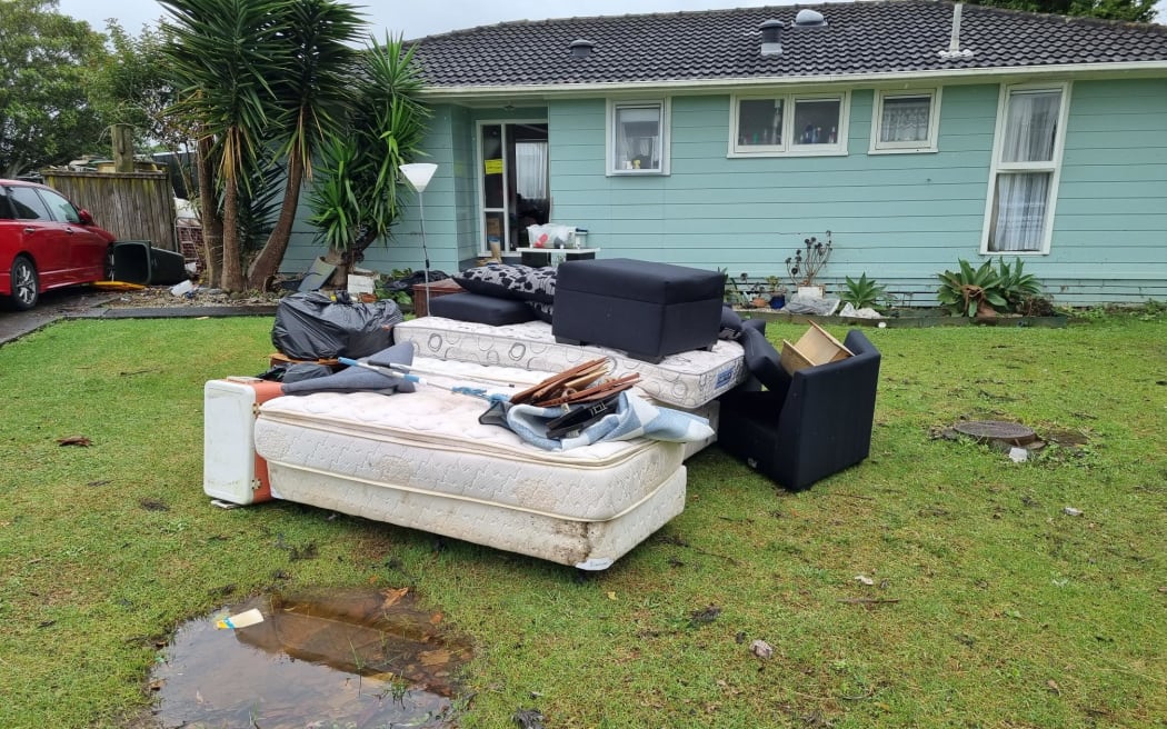 Flood damaged items in the backyard of a Māngere house.