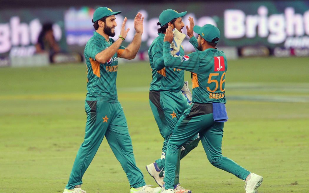 Pakistan celebrate a wicket.