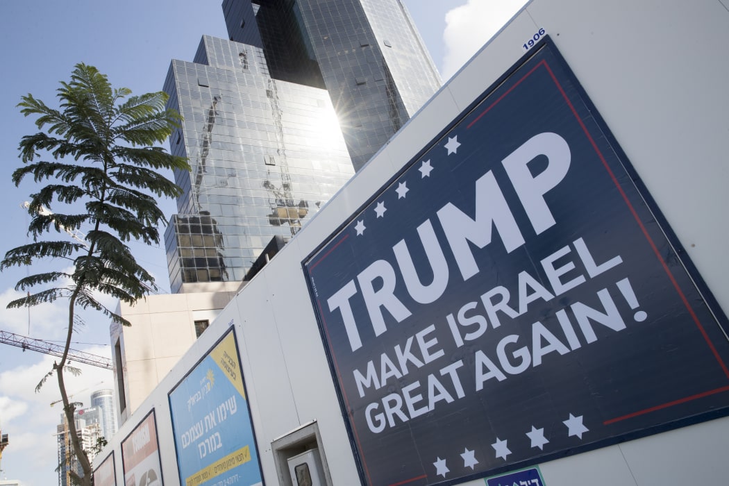 A placard in the Israeli city of Tel Aviv. Donald Trump had pressed for the US to use its veto to prevent a UN Ssecurity Council resolution condemning Israeli settlements from passing.