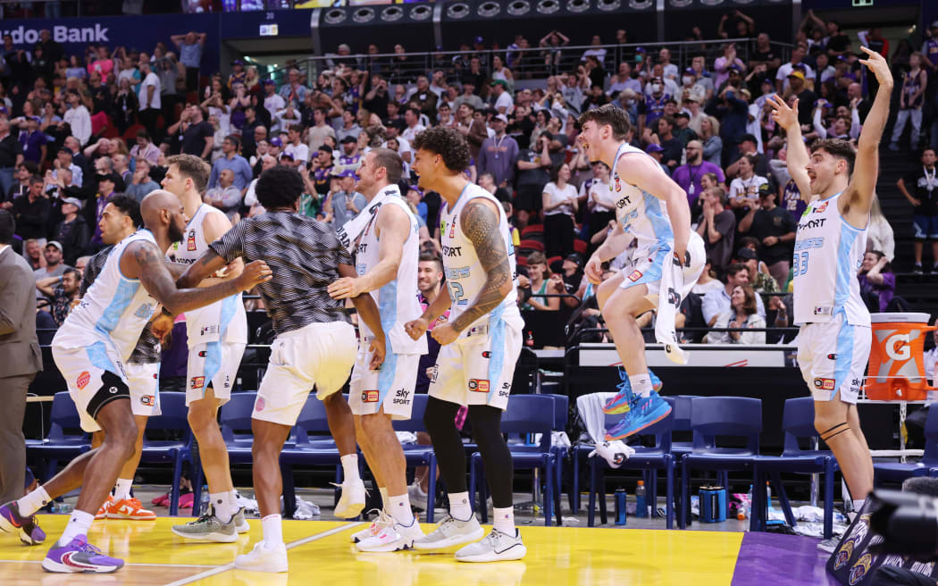 The Breakers bench celebrate a win.