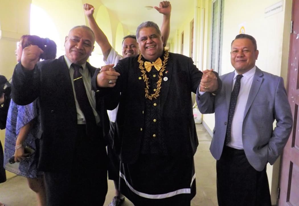 Laauli (middle) celebrates his not guilty verdict