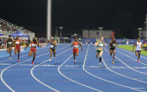 Pacific Games women's 100m final - Australia’s Georgia Harris shouts as she (third from right) crosses the finish line [11.7 secs] to claim gold for her country. PNG’s Asila Apkup (third from left) won silver [11.86 secs] and Guam’s Regine Tugade-Watson (Fourth from left) won bronze [11.92secs]. Solomon Islands National Stadium 28 November 2023