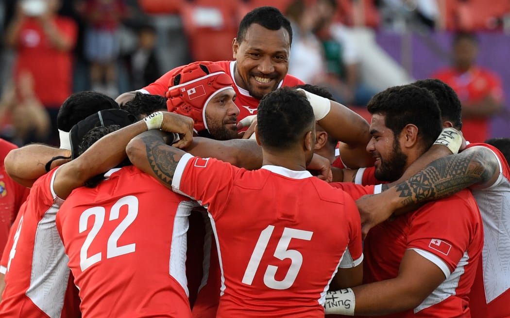 Tonga's players celebrate winning the Japan 2019 Rugby World Cup Pool C match between the United States and Tonga at the Hanazono Rugby Stadium.