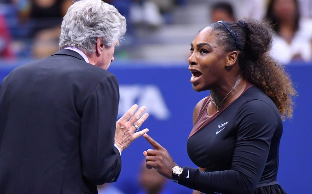 Serena Williams debates her case with tournament match officials.