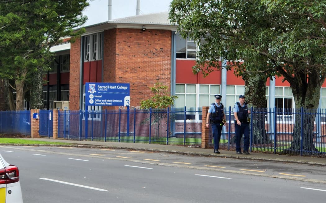 Police officers at Sacred Heart College in Auckland