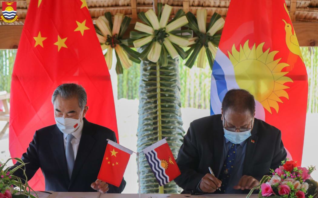 Wang Yi signing agreements with Kiribati President Taneti Maamau