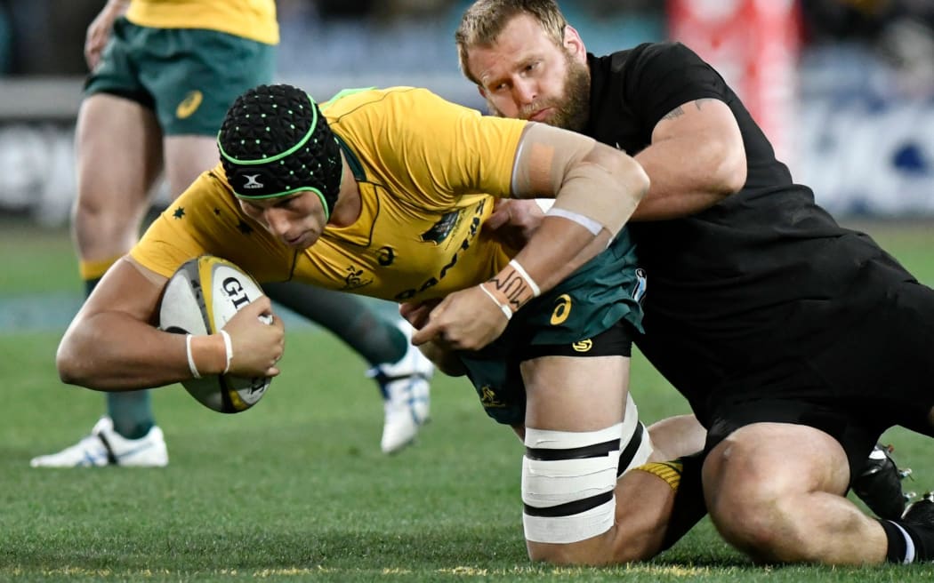 Wallabies lock Adam Coleman is tackled by All Black prop Joe Moody in the first Bledisloe Cup test in Sydney.
