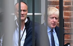 Britain's Prime Minister Boris Johnson (right) and his special advisor Dominic Cummings leave Downing Street in central London.