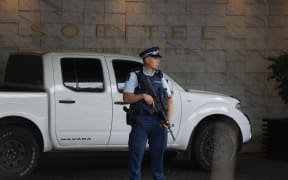 An armed police officer at the Sofitel in Viaduct Basin, Auckland.