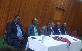 The five members of Papua New Guinea's government who have resigned.