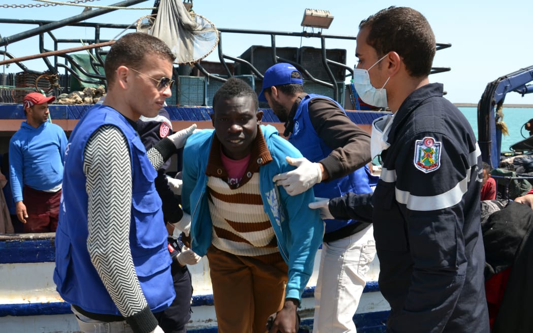 Migrants arrive at the port in the Tunisian town of Zarzis following the rescue.