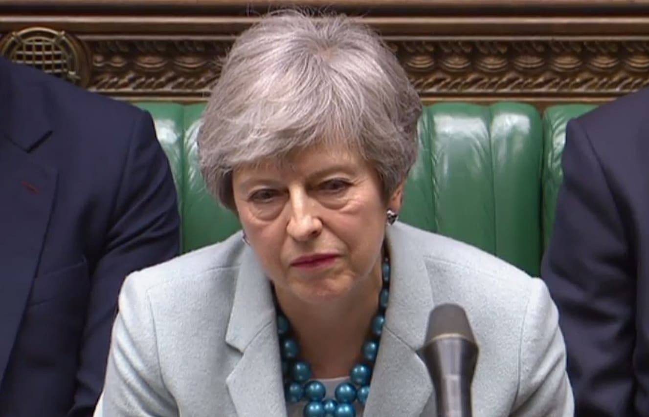 Britain's Prime Minister Theresa May listen as opposition leader Jeremy Corbyn speaks in the House of Commons in London on March 25, 2019 after May outlined the next steps that parliament will take in the Brexit process.