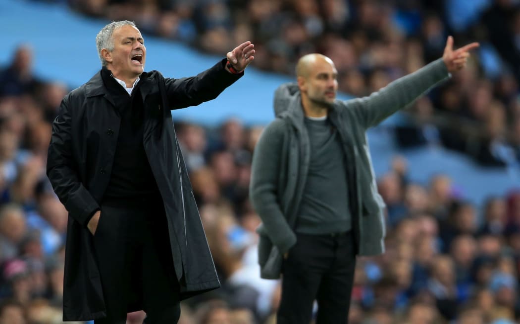 Manchester City v Manchester United - Man Utd manager Jose Mourinho (L) and Man City manager Pep Guardiola.