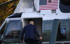 US President Donald Trump boards Marine One prior to departure from the South Lawn of the White House in Washington, DC, October 2, 2020, as he heads to Walter Reed Military Medical Center, after testing positive for Covid-19.