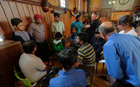 Indian students facing deportation, supporters and media at the Auckland Unitary Church in Ponsonby.